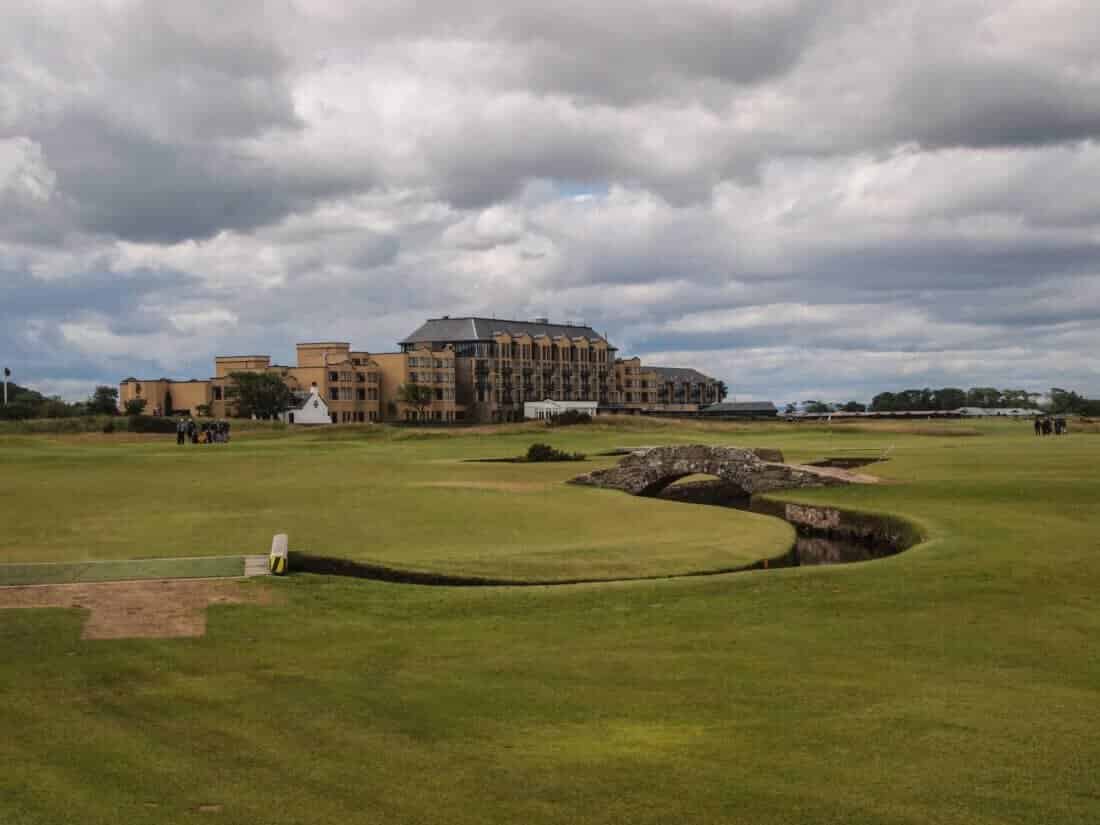 Famous bridge overpass on St Andrews Links Old Course golf course in St Andrews Scotland with Old Course Hotel in background