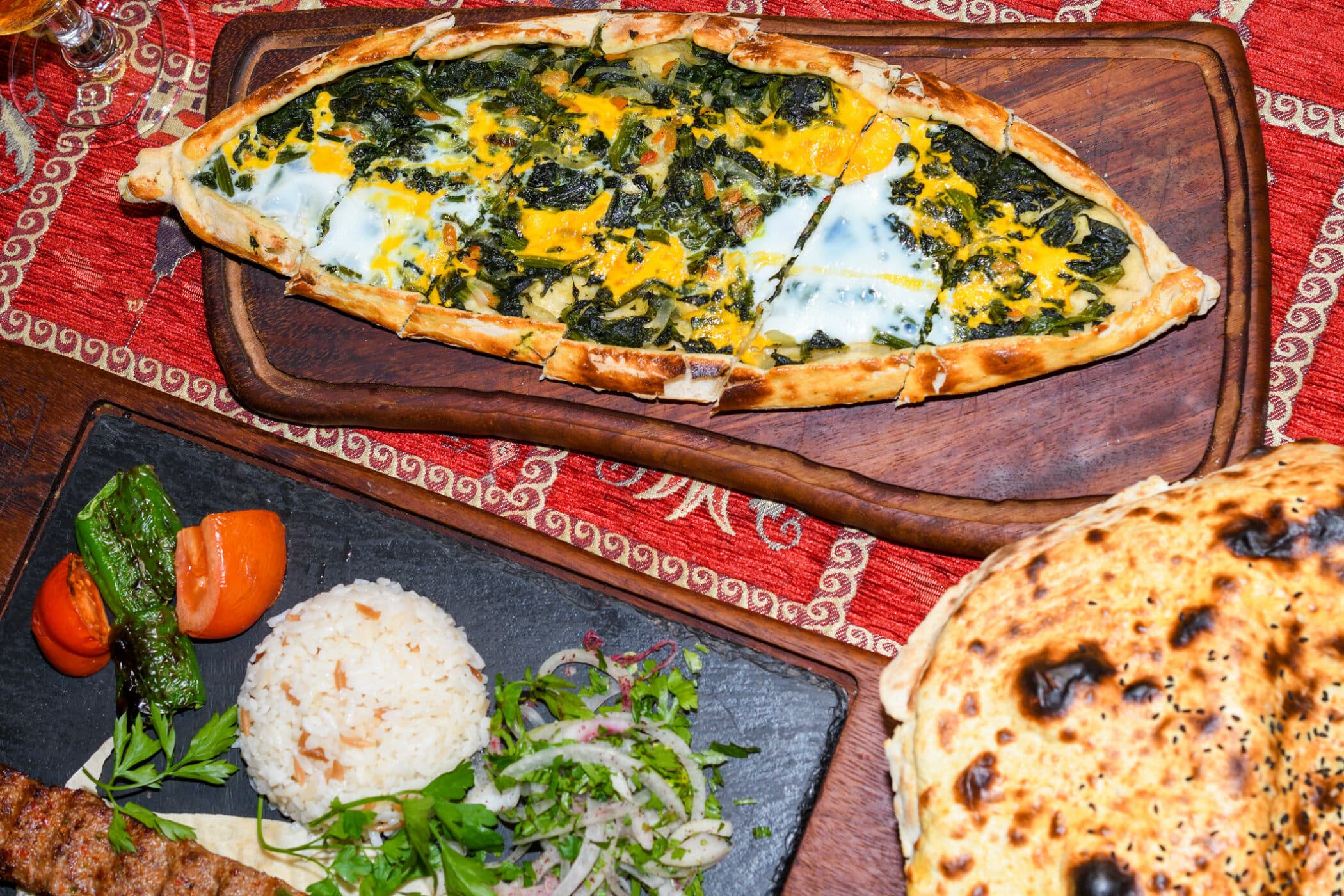 Spinach and egg pide, pita flat bread and puff hot lavash or lavas homebaked specialty