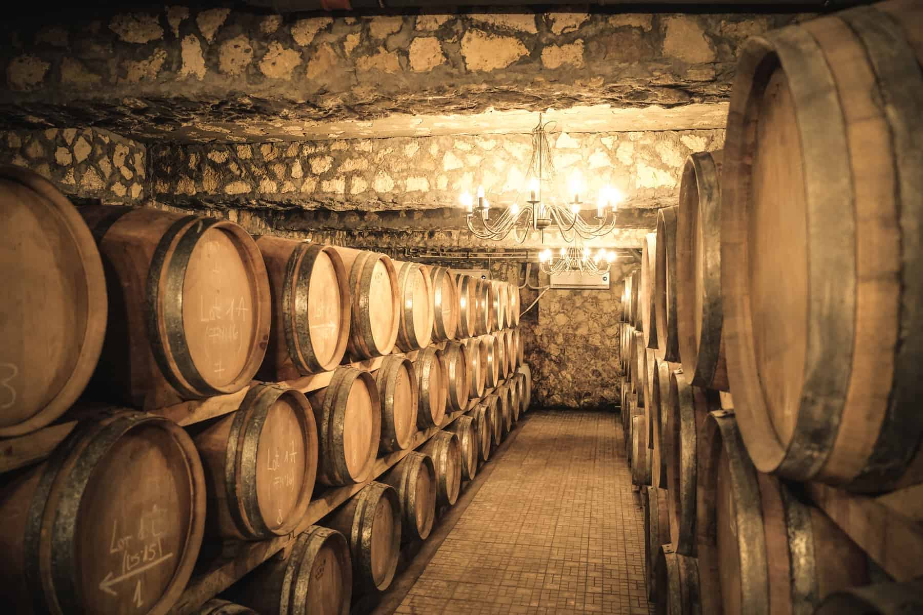 Vintage winery cellar with wine barrels