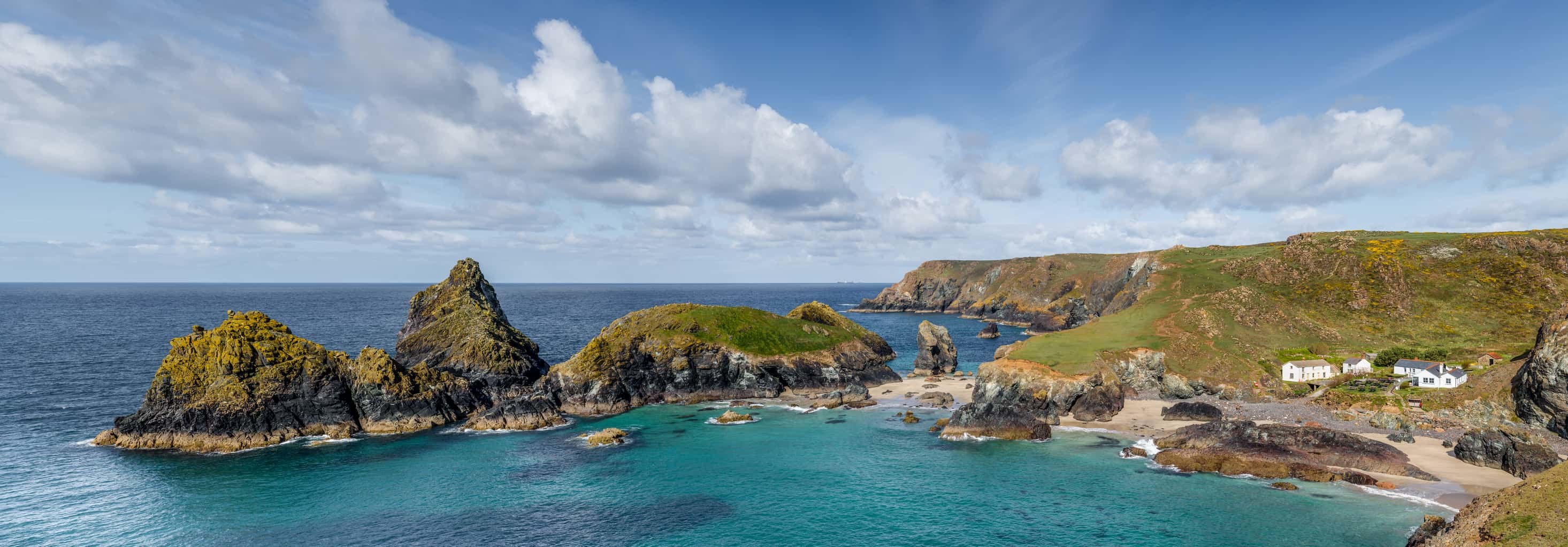 Panoramic photograph of a beautiful Spring day on the west coast of Cornwall at Kynance Cove. UK