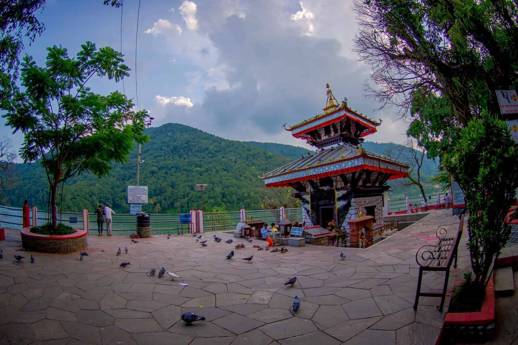POKHARA, NEPAL -People walking around of Tal Barahi Temple, located at the center of Phewa Lake, is the most important religious monument of Pokhara.
