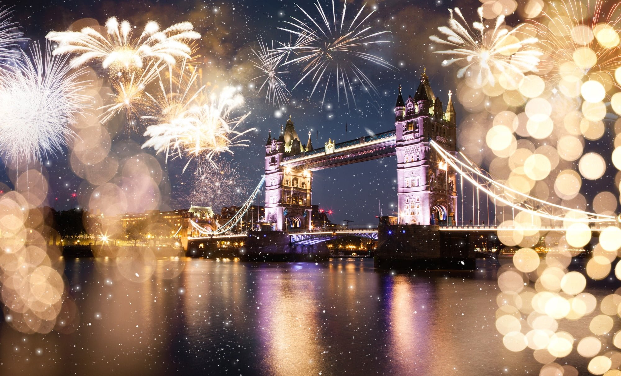 Tower Bridge with fireworks celebration of the New Year in London UK