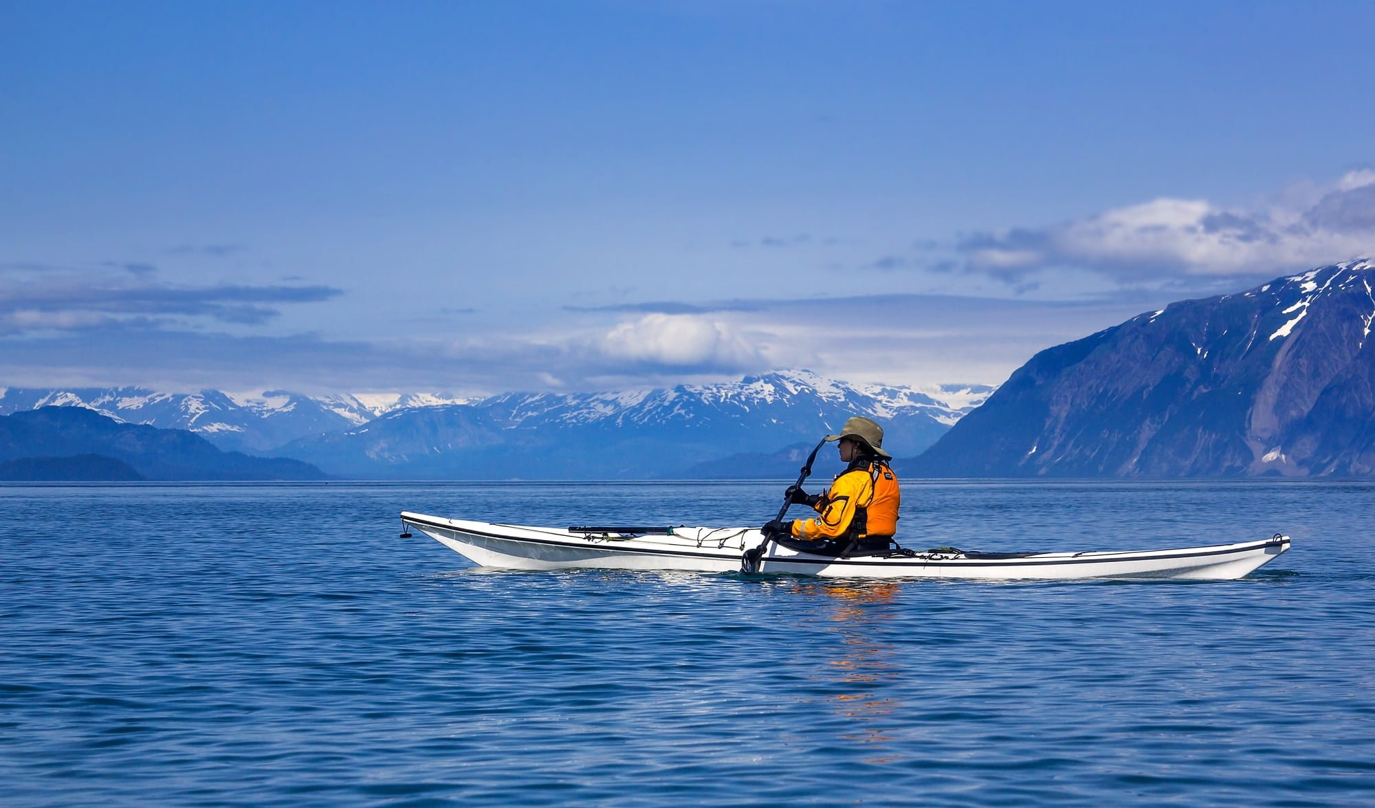 Female kayaker paddling in Glacier Bay National Park, Alaska