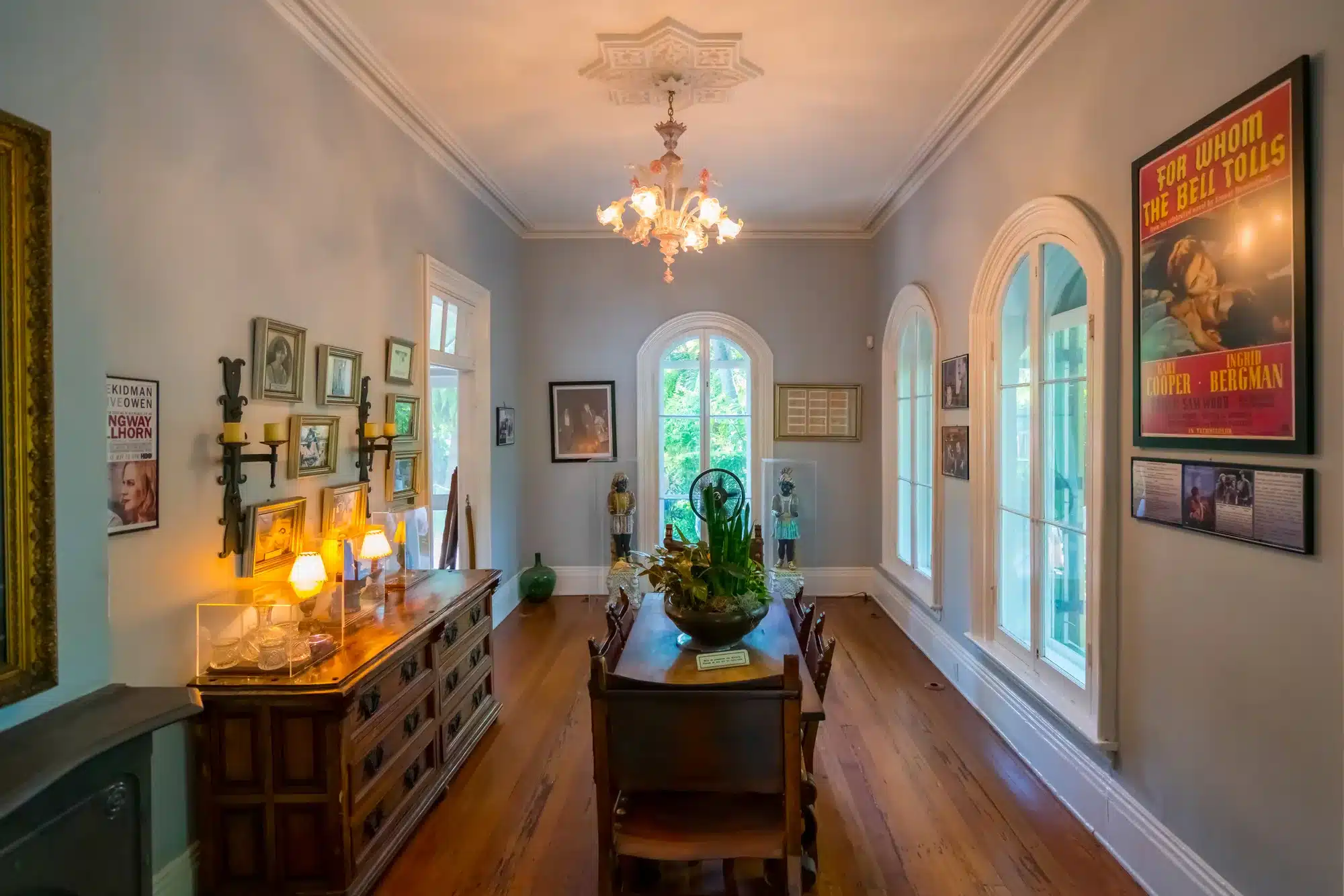 Key West, Florida, Interior of Ernest Hemingway home. Luxurious villa in Spanish colonial style. Dining room with old Spanish wooden furniture and big windows. Luxury vintage home.
